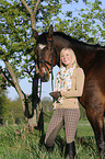 woman and Bavarian warmblood