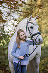 Connemara Pony with a child