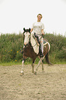 woman rides Criollo