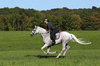 woman rides english thoroughbred