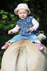 Baby on horses back