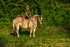 woman rides Fjordhorse