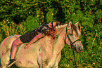 woman and Fjordhorse