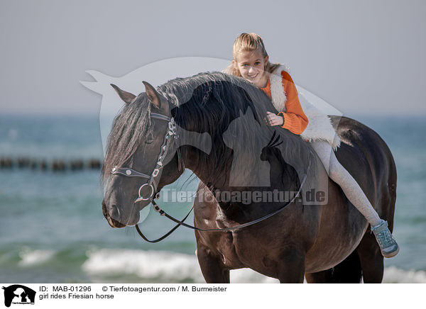 girl rides Friesian horse / MAB-01296