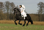 angel and friesian horse