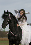 angel and friesian horse