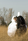 angel and friesian horse