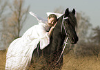 angel and friesian horse