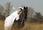 angel and friesian horse