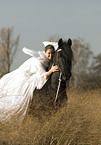 angel and friesian horse