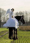 angel and friesian horse