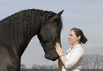 woman and frisian horse