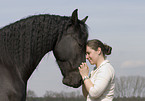 woman and frisian horse