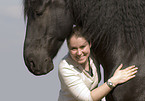 woman and frisian horse