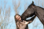 woman and Friesian horse