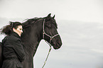 woman and Frisian Horse