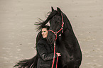 woman and Frisian Horse