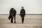 woman and Frisian Horse