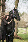 woman and Frisian Horse