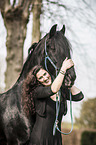 woman and Frisian Horse