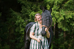 woman and Friesian Horse