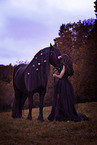 young woman with Frisian Horse