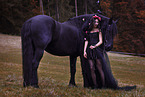 young woman with Frisian Horse
