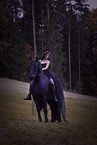 young woman with Frisian Horse