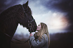 woman with Friesian Horse