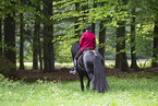 woman with Friesian horse