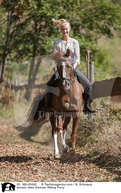 woman rides German Riding Pony / NS-05492