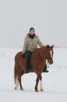 woman rides pony