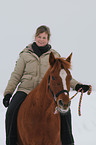 woman rides pony