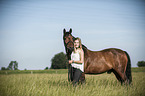 woman and German Riding Pony