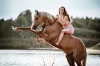 woman rides German Riding Pony