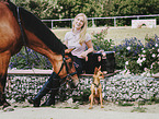 woman with horse and dog