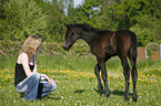 young woman with foal