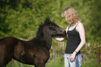 young woman with foal