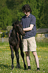 young man with foal