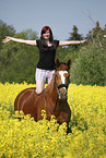 woman rides warmblood