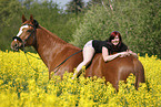 woman rides warmblood