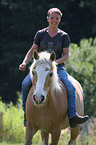 girl and Haflinger horse