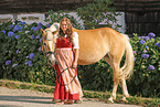 woman and Haflinger horse