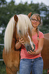 woman and Haflinger