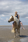 woman rides Haflinger Horse