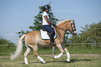woman rides Haflinger