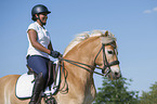 woman rides Haflinger