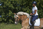 woman rides Haflinger