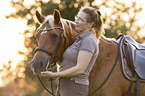 woman and Haflinger horse