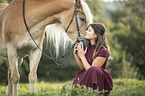 woman and Haflinger